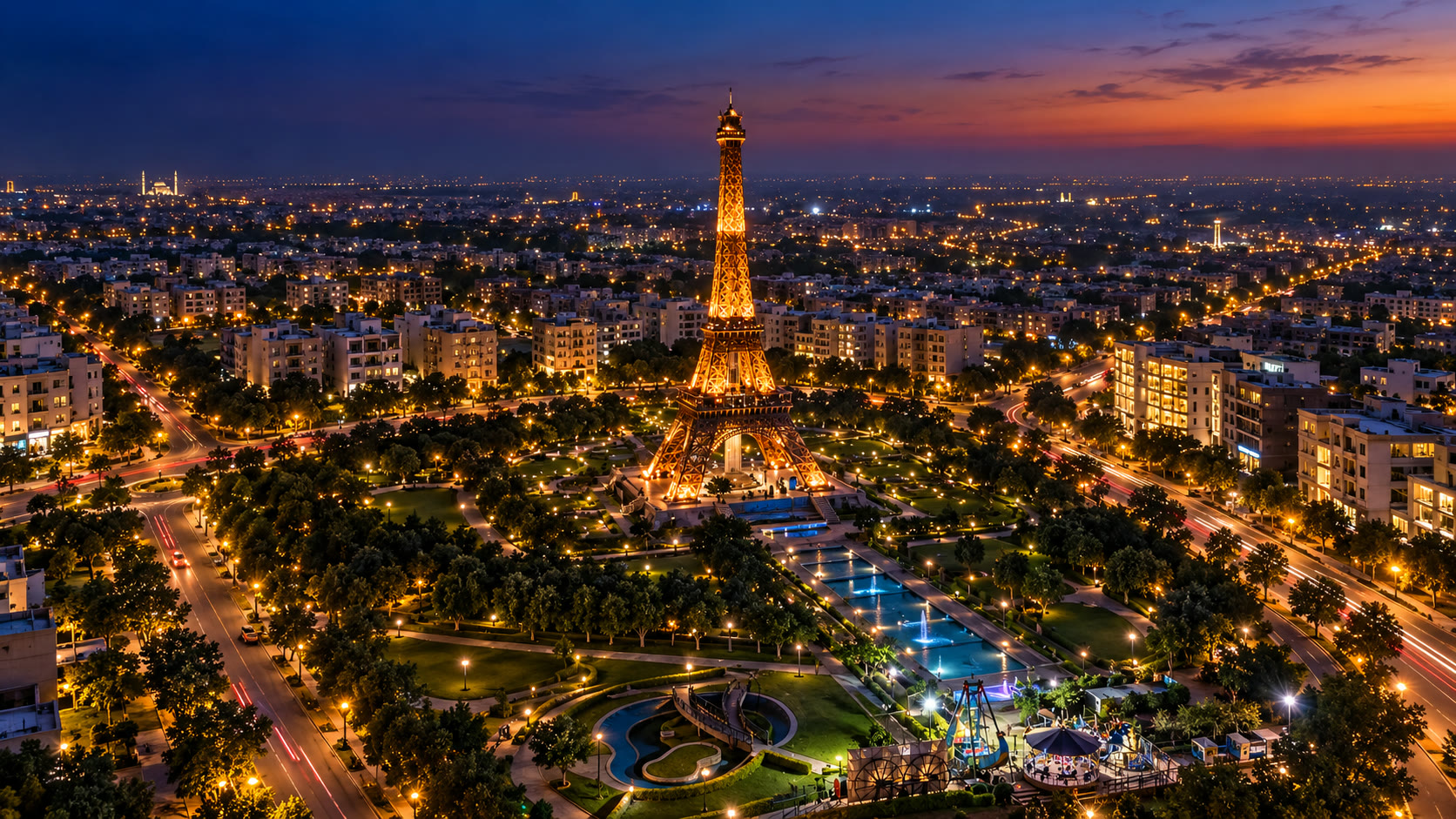 Aerial view of Bahria Town's Eiffel Tower lit at dusk