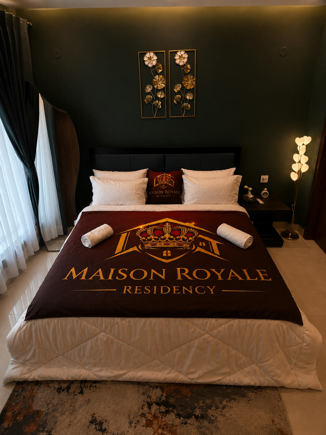 Maison Forest bed dressed in crisp white linen with the Maison Royale throw